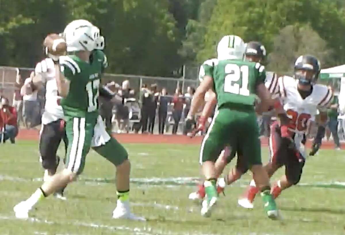 Nick Kimball throws a pass for New Milford earlier this year. A senior, he has has taken over as the team’s quarterback.