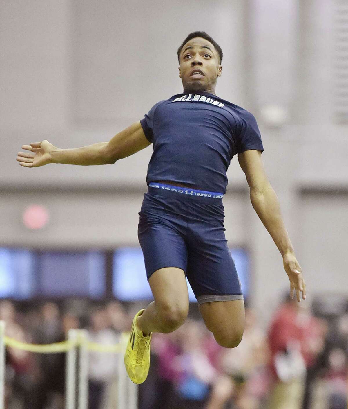 Hillhouse senior Shawn Fletcher lands in at 20′ 8.25″ in the long jump to place fifth and help the Academics win their first SCC Indoor Track championship title since 2008 on Friday, February 6, 2015 at the Floyd Little Athletic Center in New Haven. (Photo Catherine Avalone)