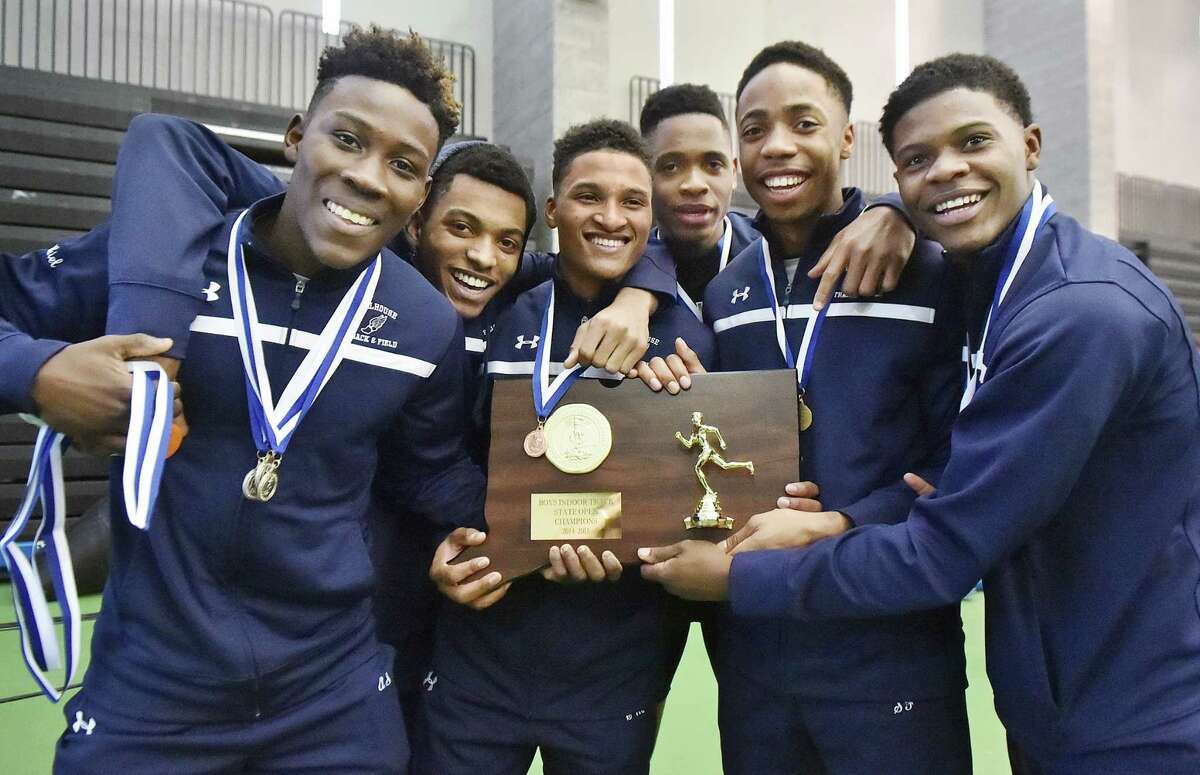 (Catherine Avalone – New Haven Register) Members of the Hillhouse Boys Track & Field team, from left to right, Akiel Smith, Tyreise Swain Jr, Corey Maddox, Brendon Stewartson, Shawn Fletcher and Gabriel Abul-Kari celebrate following their win at the Connecticut State Open Track & Field championship, Saturday, February 21, 2015, at Floyd Little Athletic Center in New Haven.