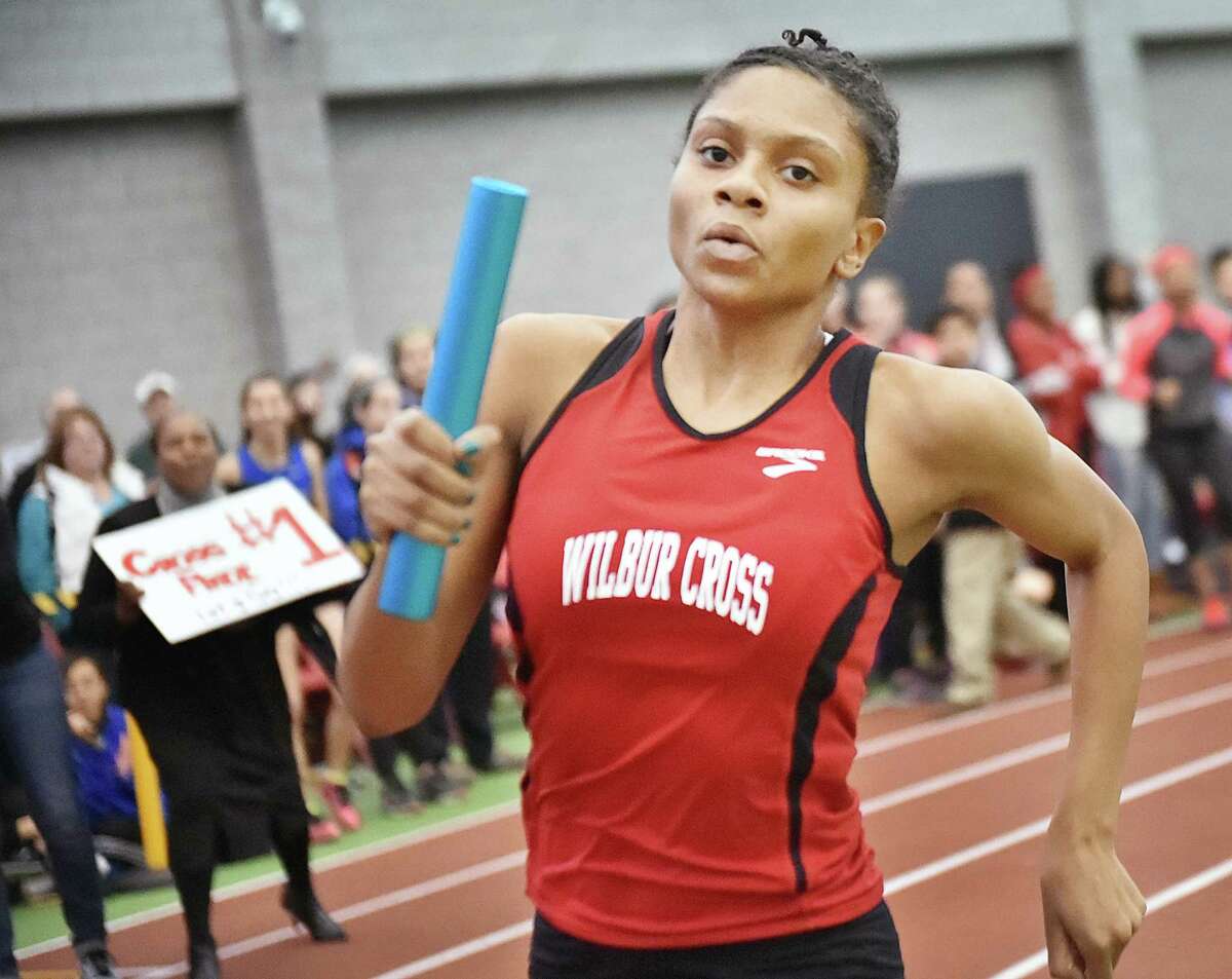 Wilbur Cross junior Danae Rivers runs the anchor of the 4×400 meter relay at the Indoor Track & Field State Open, Saturday, at the Floyd Little Athletic Center in New Haven. Team members, senior, Claudia Schatz, sophomore, Leah Rivers, junior Gabby Curtis and Rivers won the event in 4:01.63. (Catherine Avalone/New Haven Register)