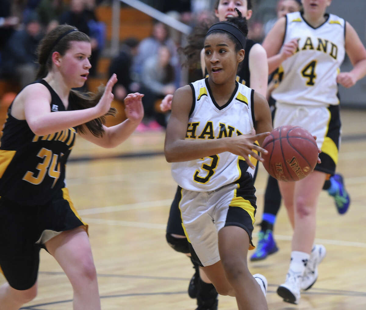 Hand’s Gabrielle Martin drives during the SCC girls basketball semifinals at Law Monday night (Photo Arnold Gold)