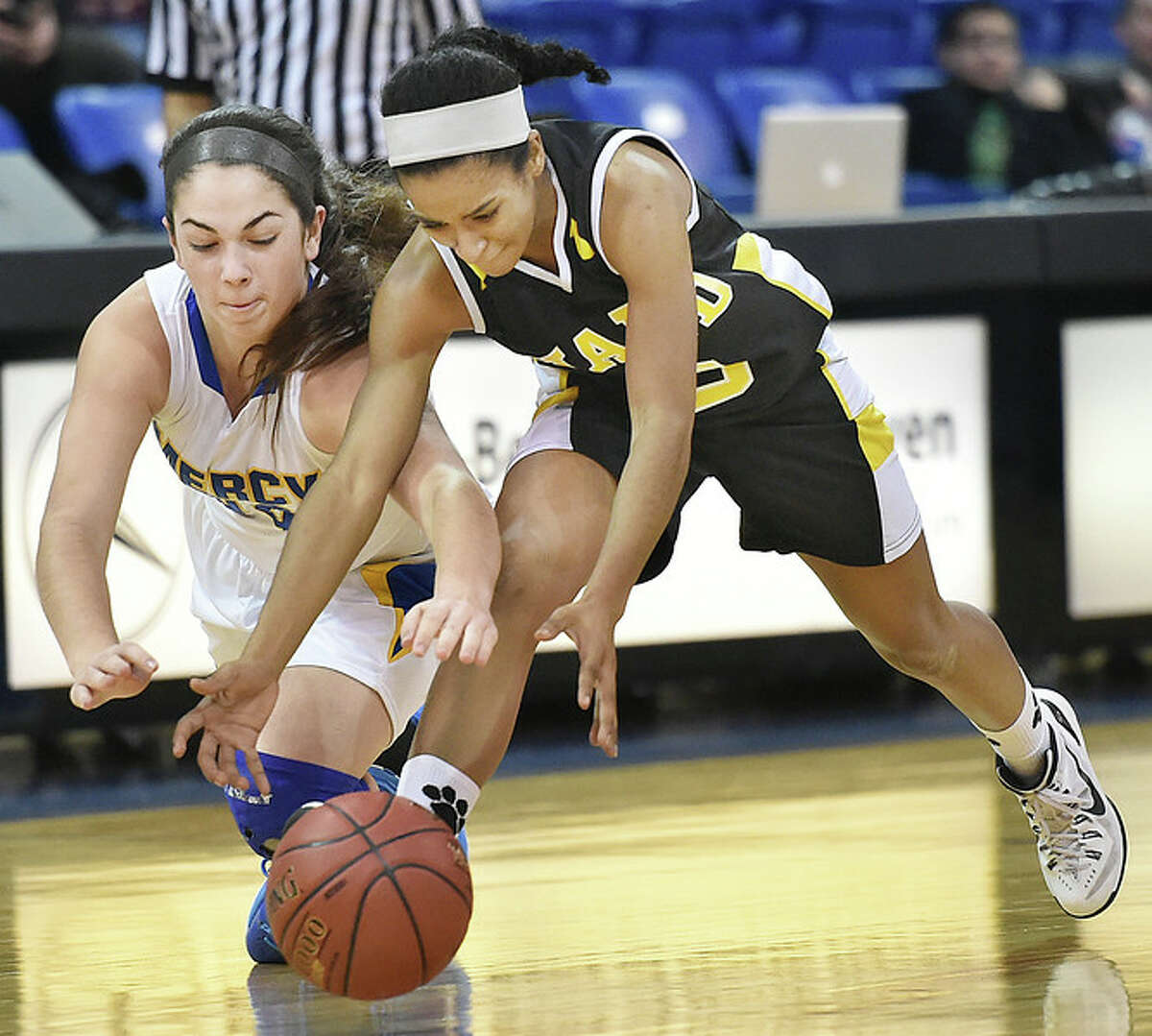 Mercy’s Samantha Gallo battles Hand’s Gabby Martin in the SCC Girls Basketball Championship game, Wednesday, February 25, 2015, at the TD Sports Center at Quinnipiac University in Hamden, Conn. The Mercy Tigers defeated the Hand Tigers, 57-52. (Photographs by Catherine Avalone/New Haven Register)