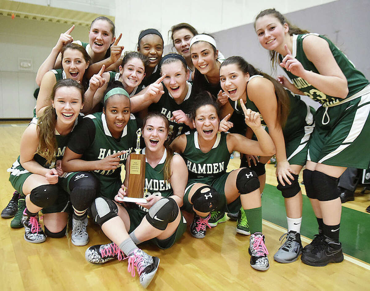 The Hamden Hall Hornets celebrate following their 66-44 win over St. Luke’s Storm to capture the Fairchester Athletic Association championship , Friday night, February 27, 2015, at Beckerman Athletic Center on Skiff Street in Hamden. (Catherine Avalone/New Haven Register)