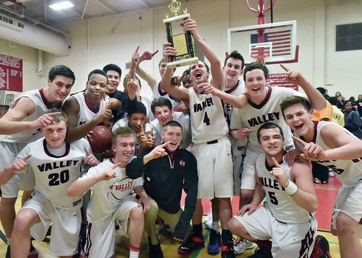 The Valley Regional Warriors celebrate following their 66-55 win over the Old Lyme Wildcats for the Shoreline championship game, Friday, March 6, 2015, at Wilbur Cross High School gymnasium in New Haven, Conn. (Catherine Avalone – New Haven Register)