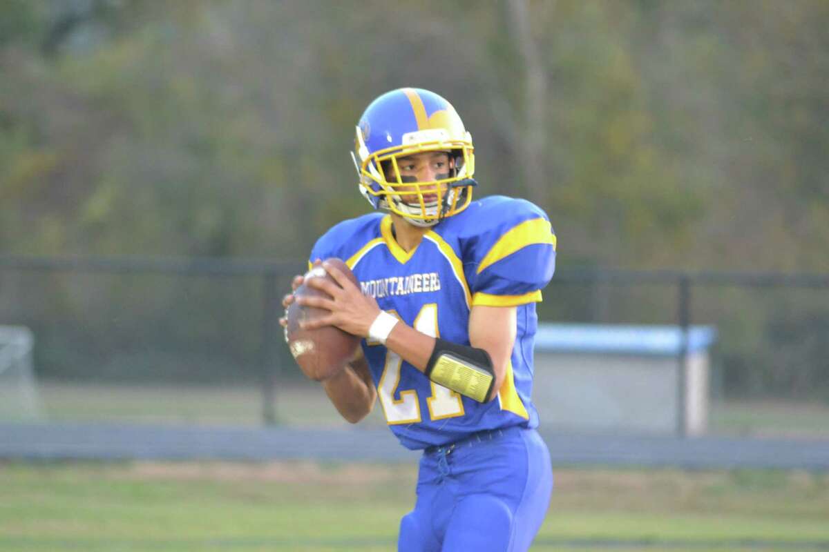 Housatonic/Wamogo’s quarterback Chance O’Neil warms up before the Mountaineers 30-8 loss to Stafford/East Windsor. O’Neil rushed for 105-yards and one touchdown in the loss.