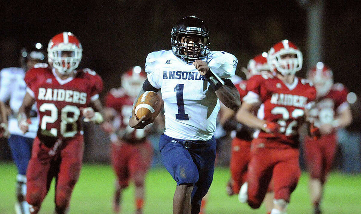 (Peter Casolino – New Haven Register) Ansonia QB Jaiquan McKnight on his way for a long TD during the 3rd quarter.