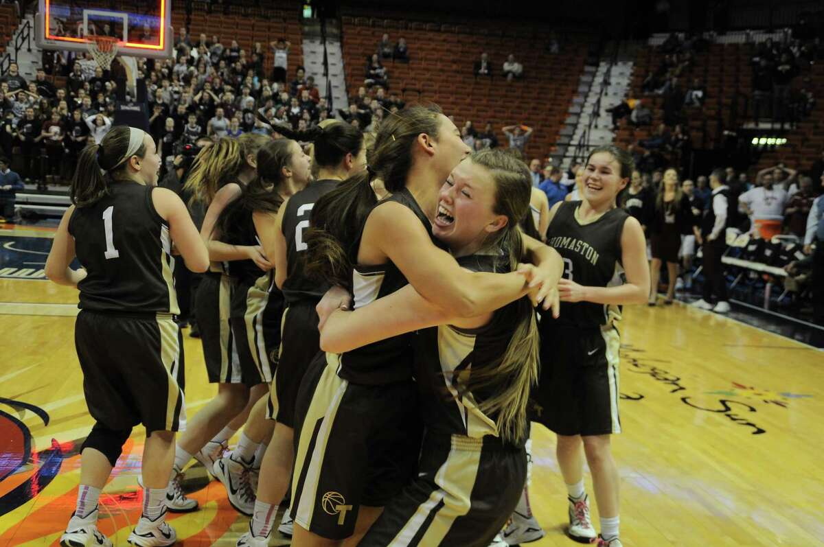 Thomaston celebrates winning back-to-back Class S girls basketball championships following a 52-50 victory over Canton at Mohegan Sun Saturday, March 21 (Photo Sean Meenaghan)