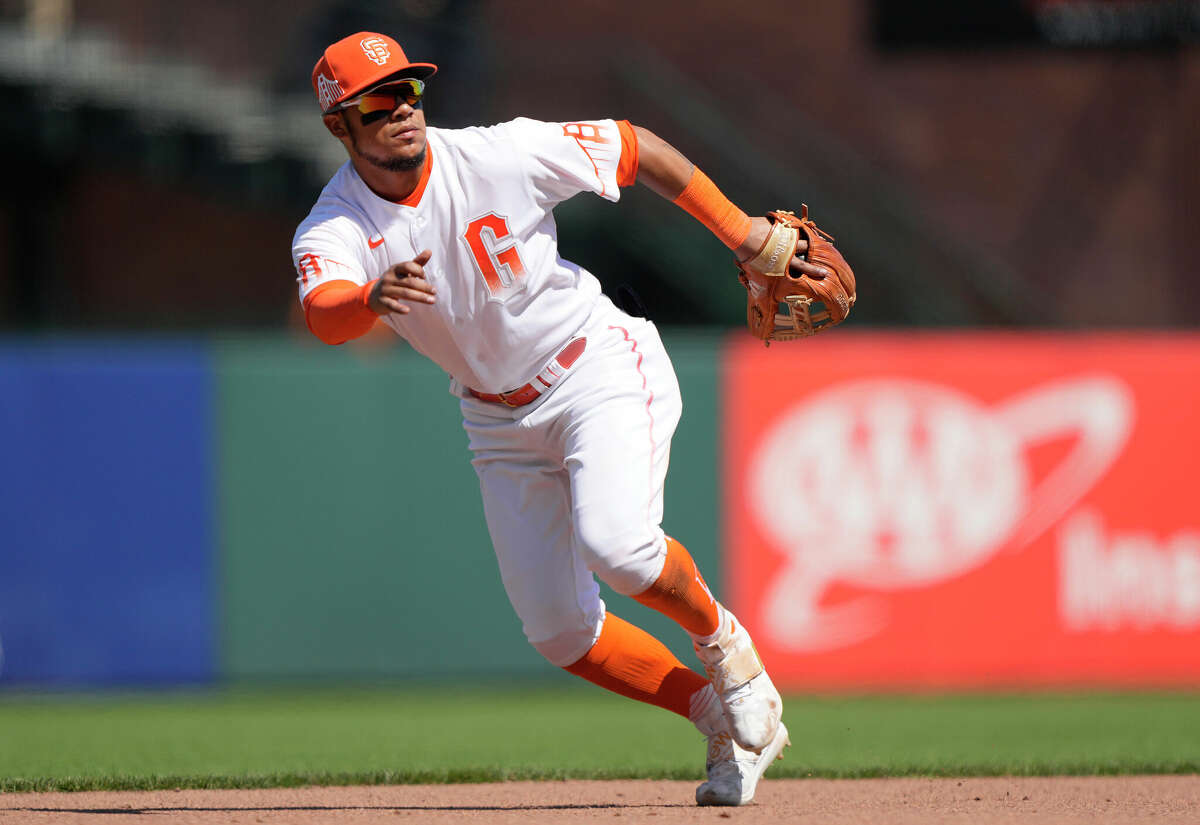 Thairo Estrada of the San Francisco Giants reacts to a ground ball against the Washington Nationals in the top of the seventh inning at Oracle Park on July 10, 2021 in San Francisco, California. The Giants are wearing an alternate uniform called City Connect.