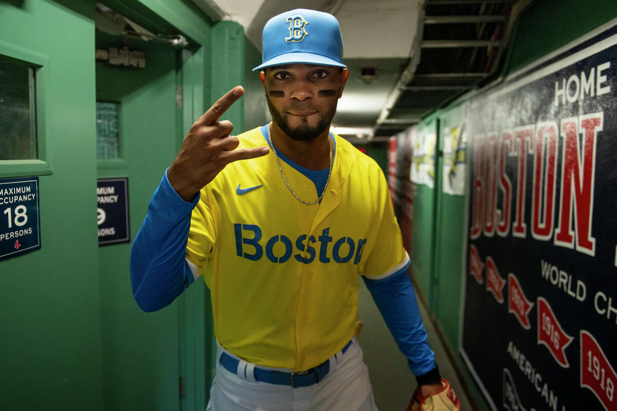Xander Bogaerts of the Boston Red Sox reacts as he wears the Nike City Connect jersey before a game against the Chicago White Sox on April 17, 2021 at Fenway Park in Boston.