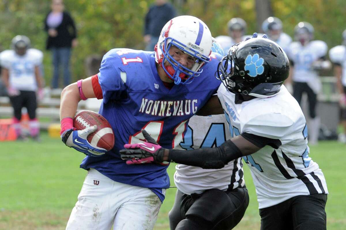 Nonnewaug’s Jon Gombos rushes during the Chiefs 26-20 loss. Gombos rushed for 107-yards and two touchdowns.