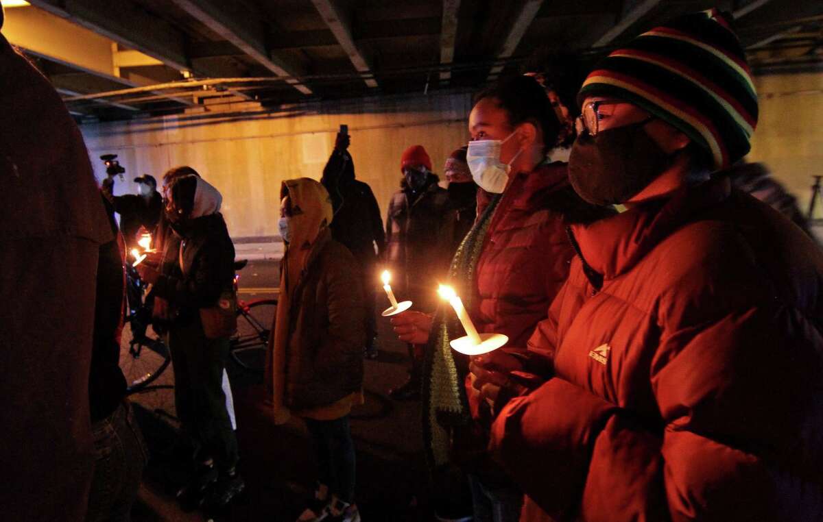 A vigil is held in memory of Mubarak Soulemane at the I-95 overpass along Campbell Avenue in West Haven, Conn., on Friday Jan. 15, 2021. Soulemane, a New Haven resident, was fatally shot by state Trooper Brian North after a car chase on Jan. 15, 2020.