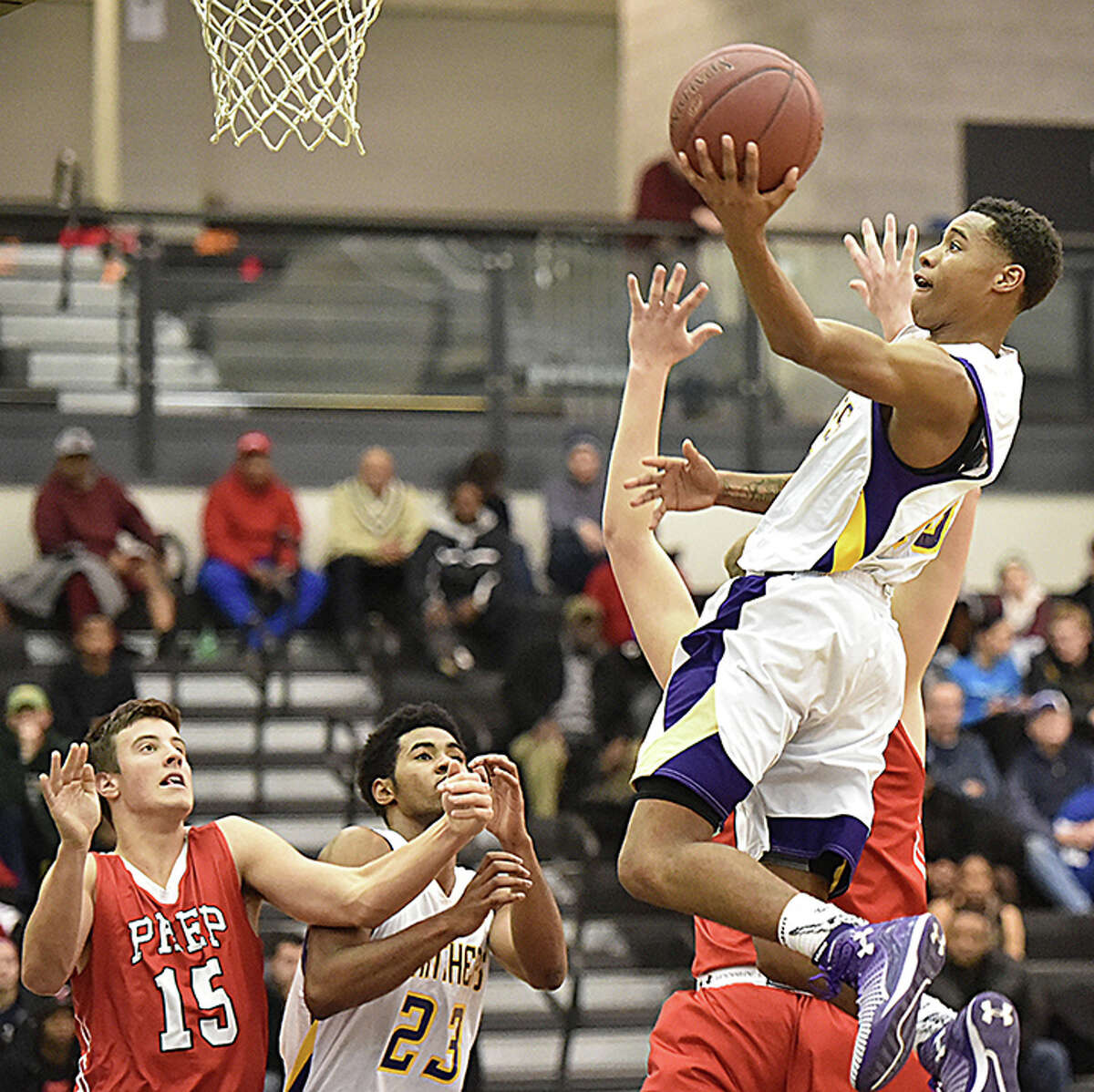Career’s Tyreek Perkins elevates for a shot as Fairfield Prep’s Patrick Harding (25) defends during the regular season. Perkins is the 2014-15 Area MVP for the New Haven Register. (Catherine Avalone/New Haven Register)