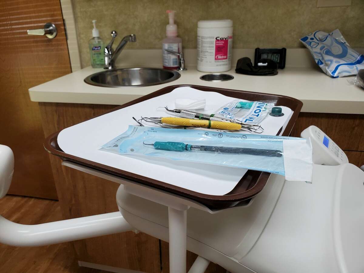 Dental tools are visible on a tray at a dentist's office in Walnut Creek, California, July 15, 2021. (Photo by Smith Collection/Gado/Getty Images)