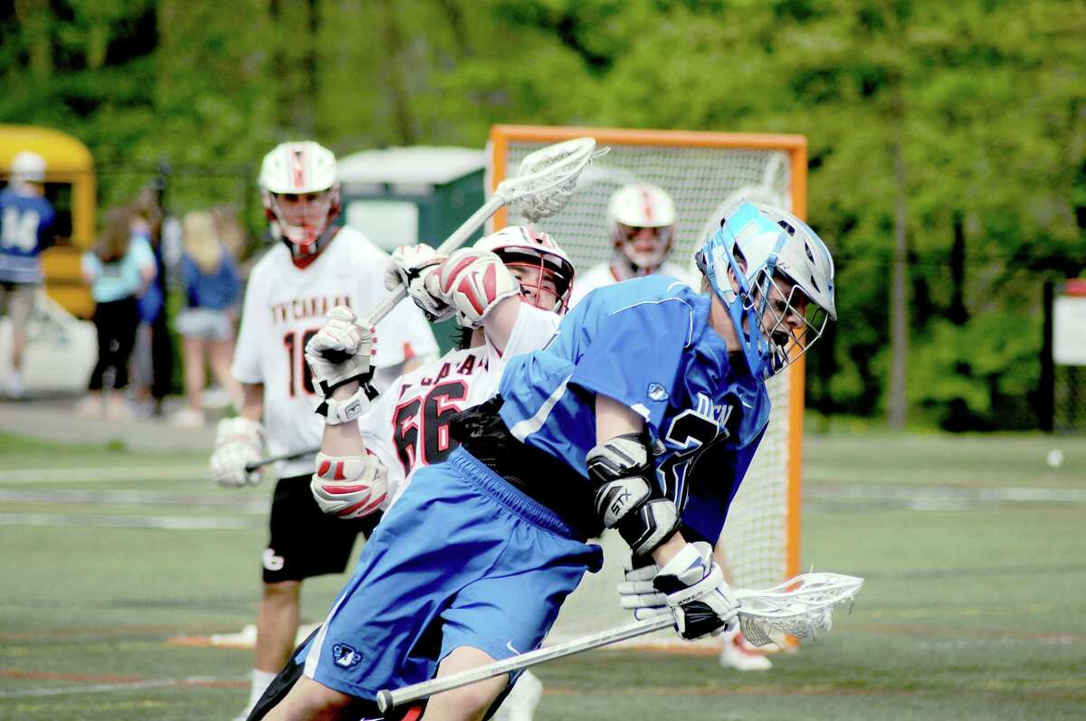 Darien’s Colin Minicus (right) leads the Blue Wave’s charge into the Class L tournament this season while Matt Cognetts (66, left) and New Canaan remain in Class M to fend off the likes of North Haven and Barlow. (Photo Sean Meenaghan)