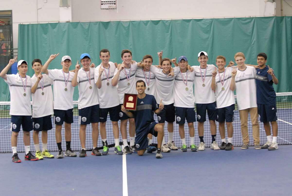 The Staples boys’ tennis team celebrates its FCIAC tile victory over Greenwich on Thursday. Photo by Keith Stein.