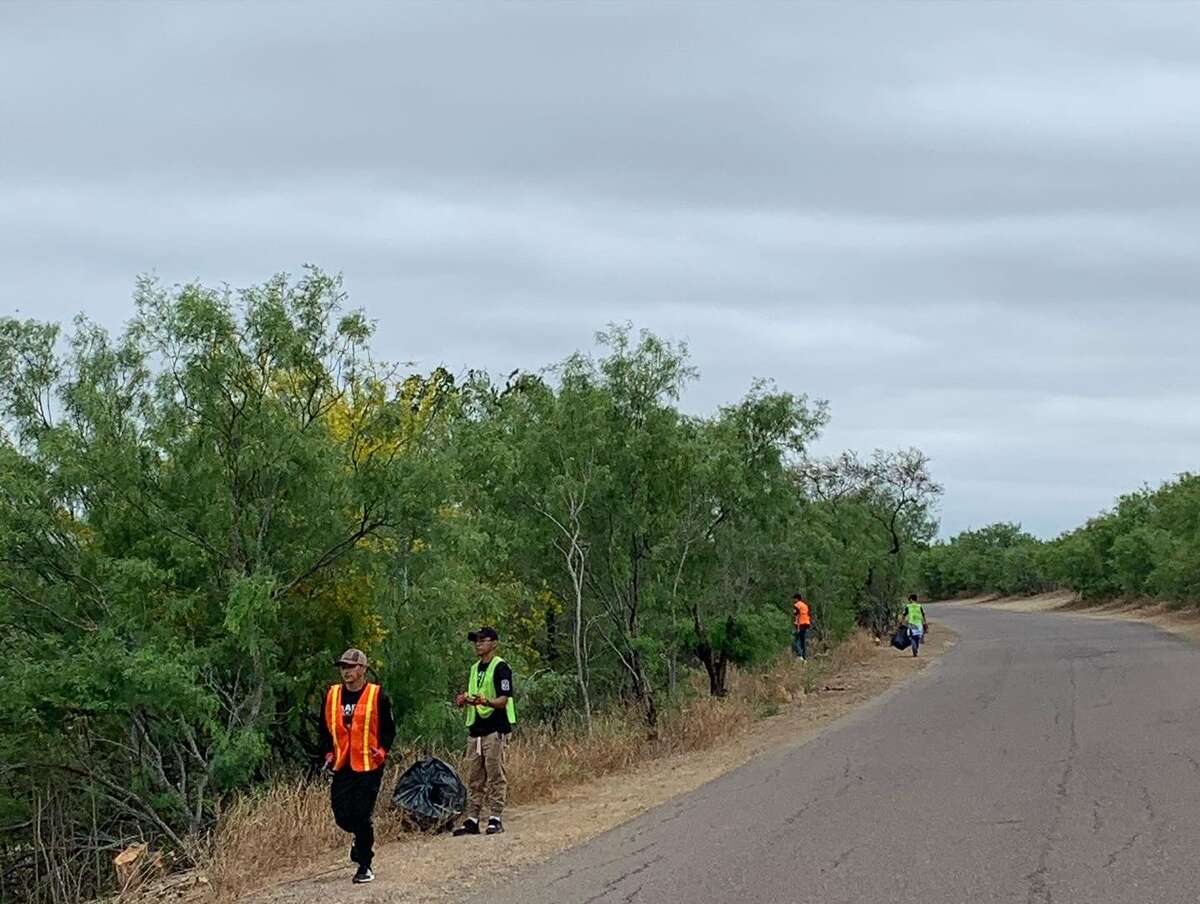Volunteers form part of the Rio Grande International Study Center's (RGISC) Post-Easter Cleanup event at Lake Casa Blanca on April 19, 2022 to clean out much of the waste left behind the holiday. In total, more than 3,000 pounds of waste were cleaned by the volunteers. 