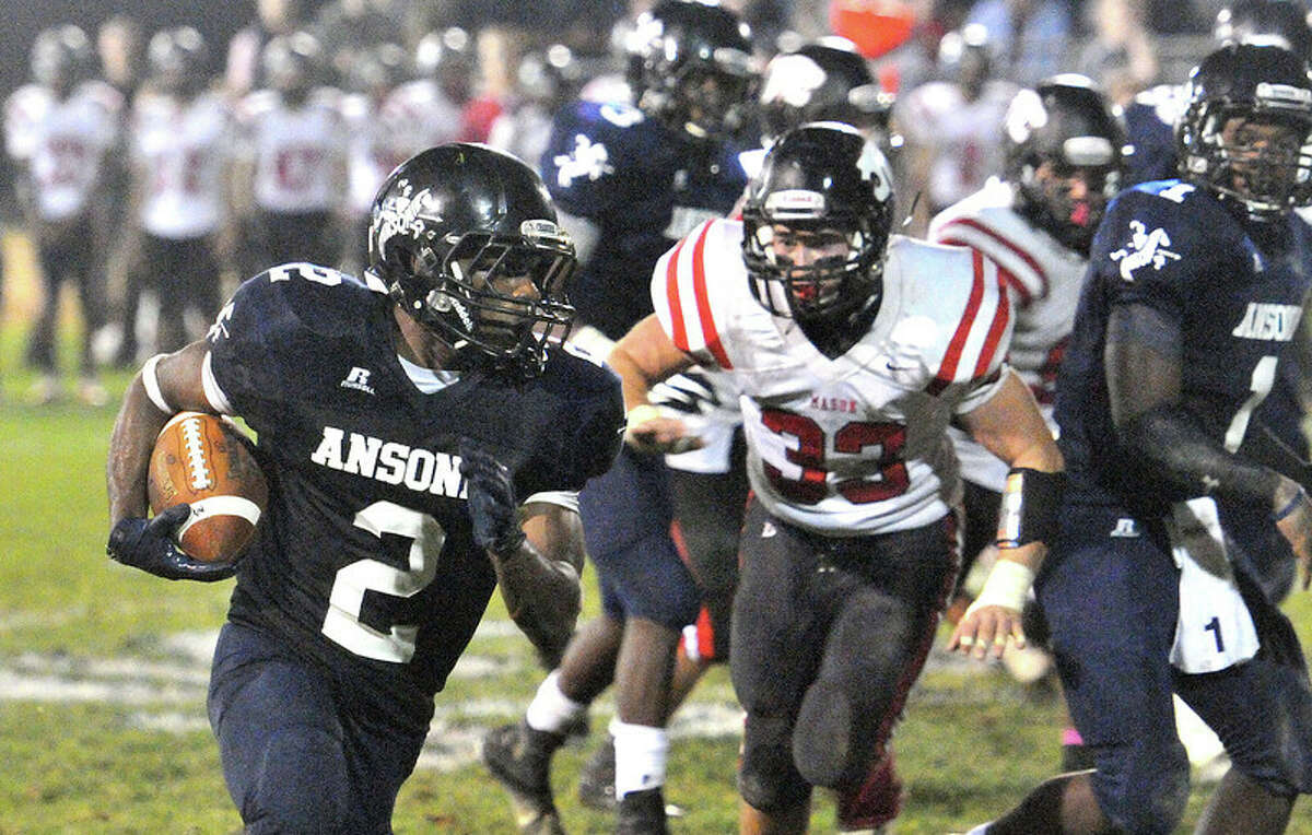 (Peter Casolino – New Haven Register) Ansonia’s Arkeel Newsome runs for a second quarter TD. He scored six and broke the state’s all-time rushing record held by former Ansonia great Alex Thomas.