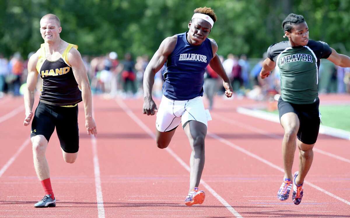 Left to right, Tommy Wilson of Daniel Hand, Akiel Smith of Hllhouse and Mark Doyley of Weaver compete in the 100 meter hurdles at the CIAC Track & Field State Open in New Britain on 6/8/2015. Smith won the event. Photo by Arnold Gold