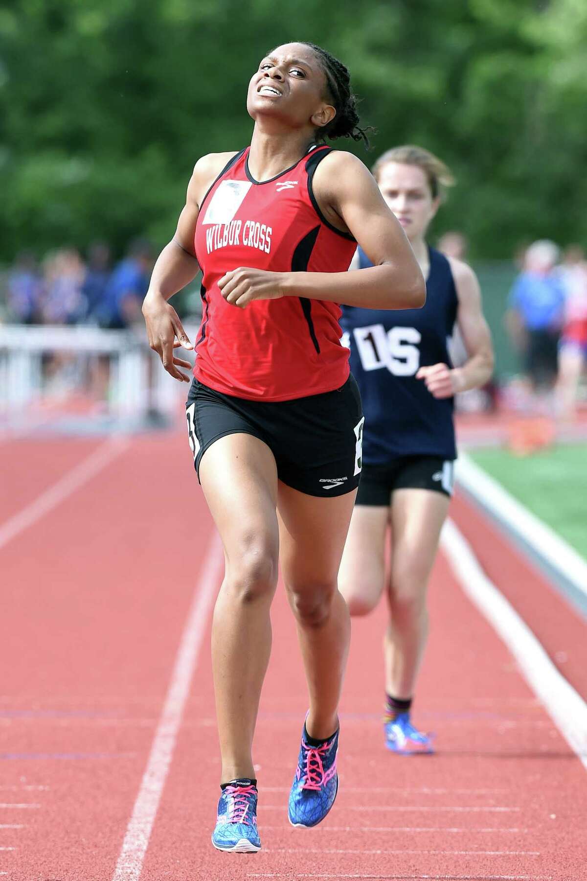 Danae Rivers of Wilbur Cross wins the 1600 meter run ahead of Hannah DeBalsi of Staples at the CIAC Track & Field State Open in New Britain on 6/8/2015. Photo by Arnold Gold/New Haven Register agold@newhavenregister.com