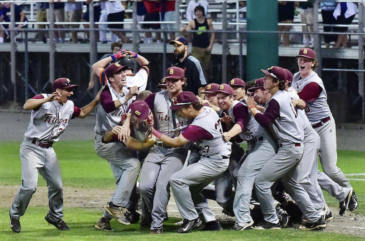 The Sheehan Titans celebrate following their 5-0 win over the Montville Indians for the Class M state baseball championship, Friday, June 12, 2015, at Palmer Field in Middletown. (Catherine Avalone/New Haven Register)