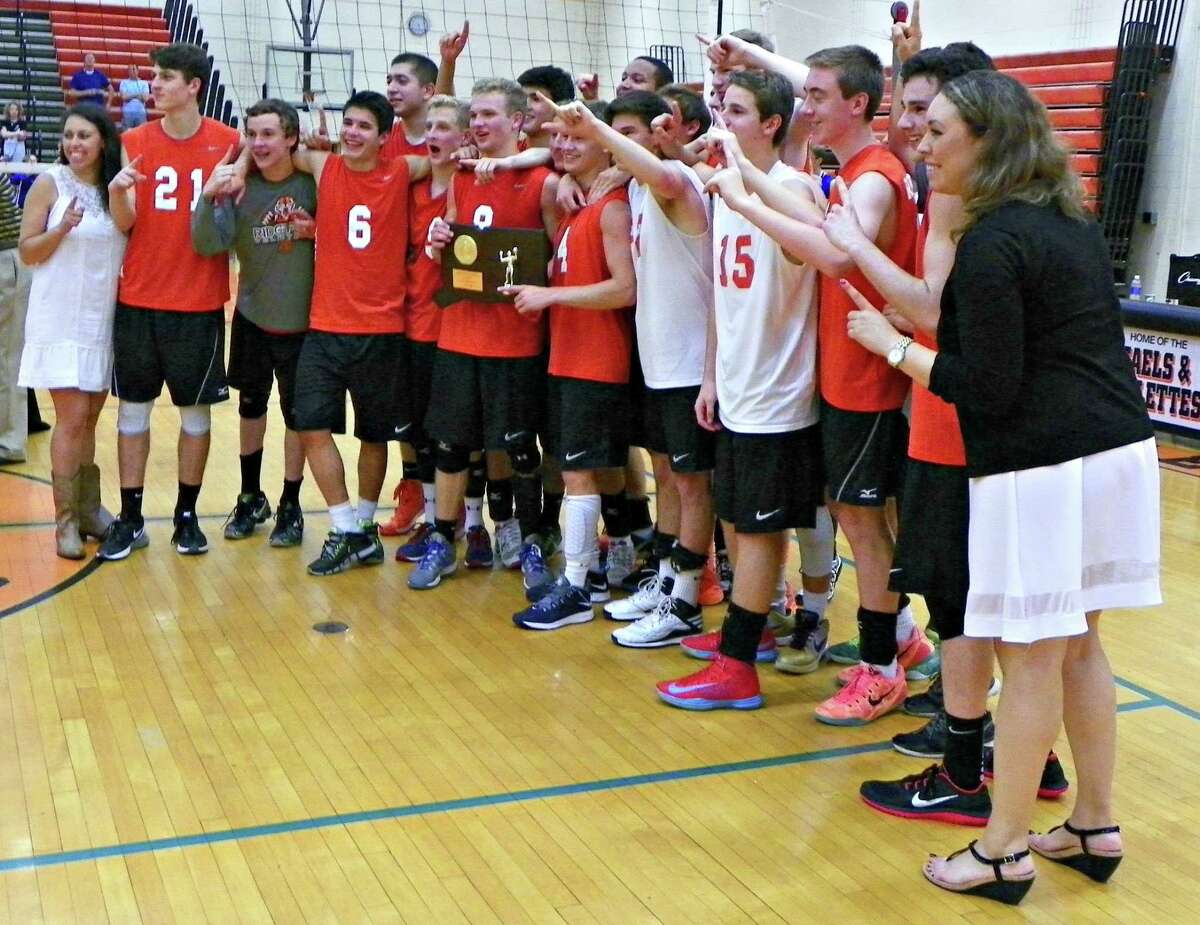 The Ridgefield boys volleyball team celebrates its second straight Class L title with a 3-1 win over FCIAC rival Darien. Derek Turner-GameTimeCT