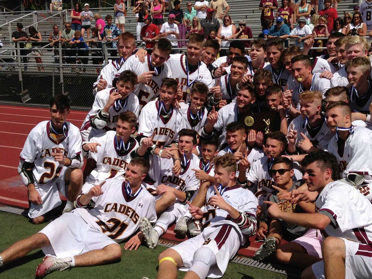 St. Joseph’s boys lacrosse team celebrates its 14-5 victory over Weston in the Class S championship game. (Photo Jim Fuller)