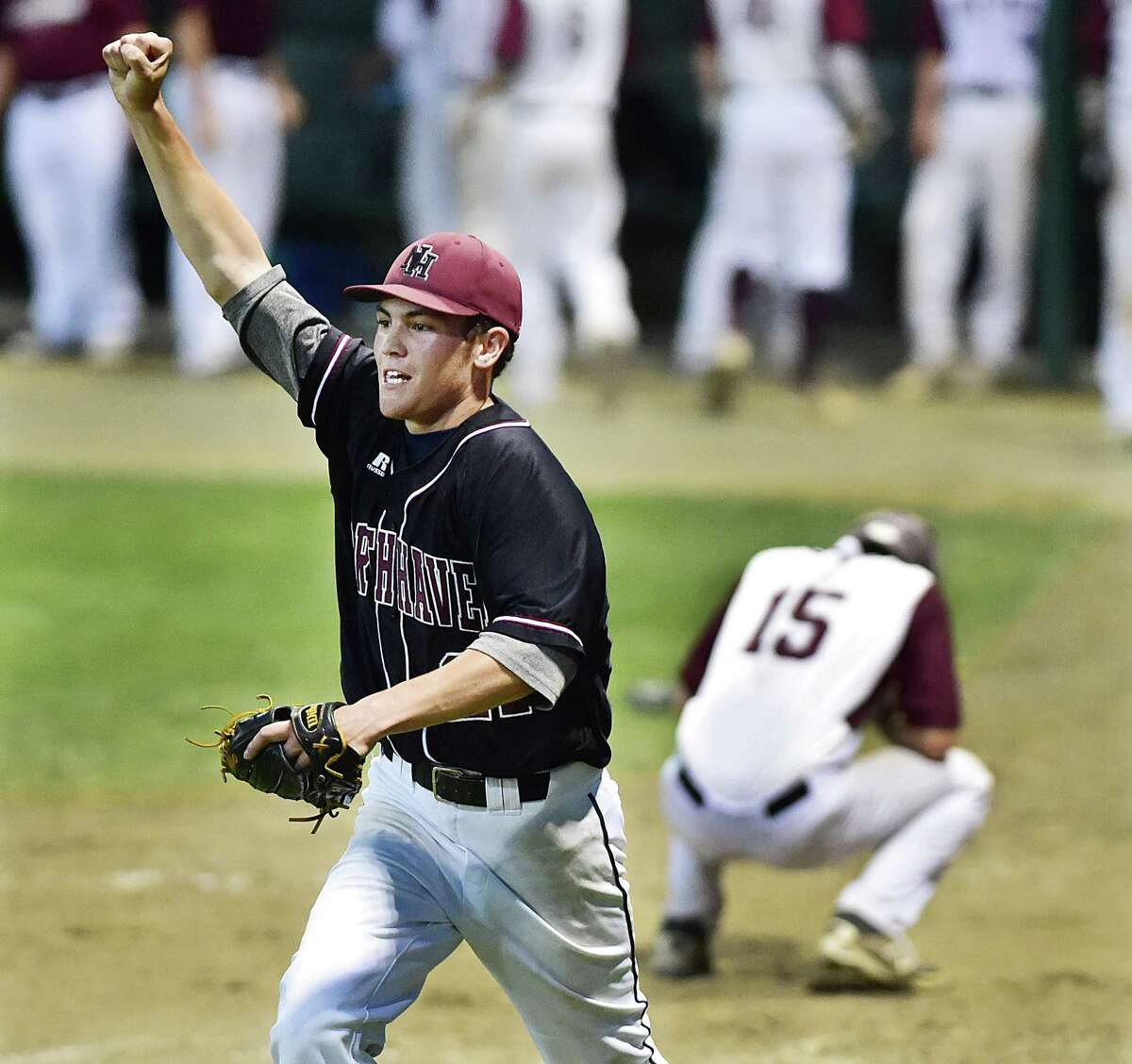 North Haven pitcher Richie DePalma celebrates after East Lyme’s Corey Levesque is called out at home. The North Haven Indians defeated the East Lyme Vikings, 3-2, in the Class L state championship game, Saturday night, June 13, 2015 at Palmer Field in Middletown. (Catherine Avalone/New Haven Register)