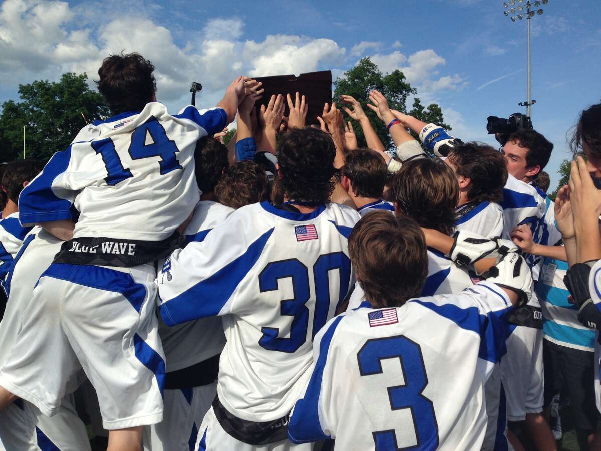 Darien’s boys lacrosse team celebrates its first Class L championship and ninth title in 11 years Saturday at McMahon (Photo Chris Hunn)