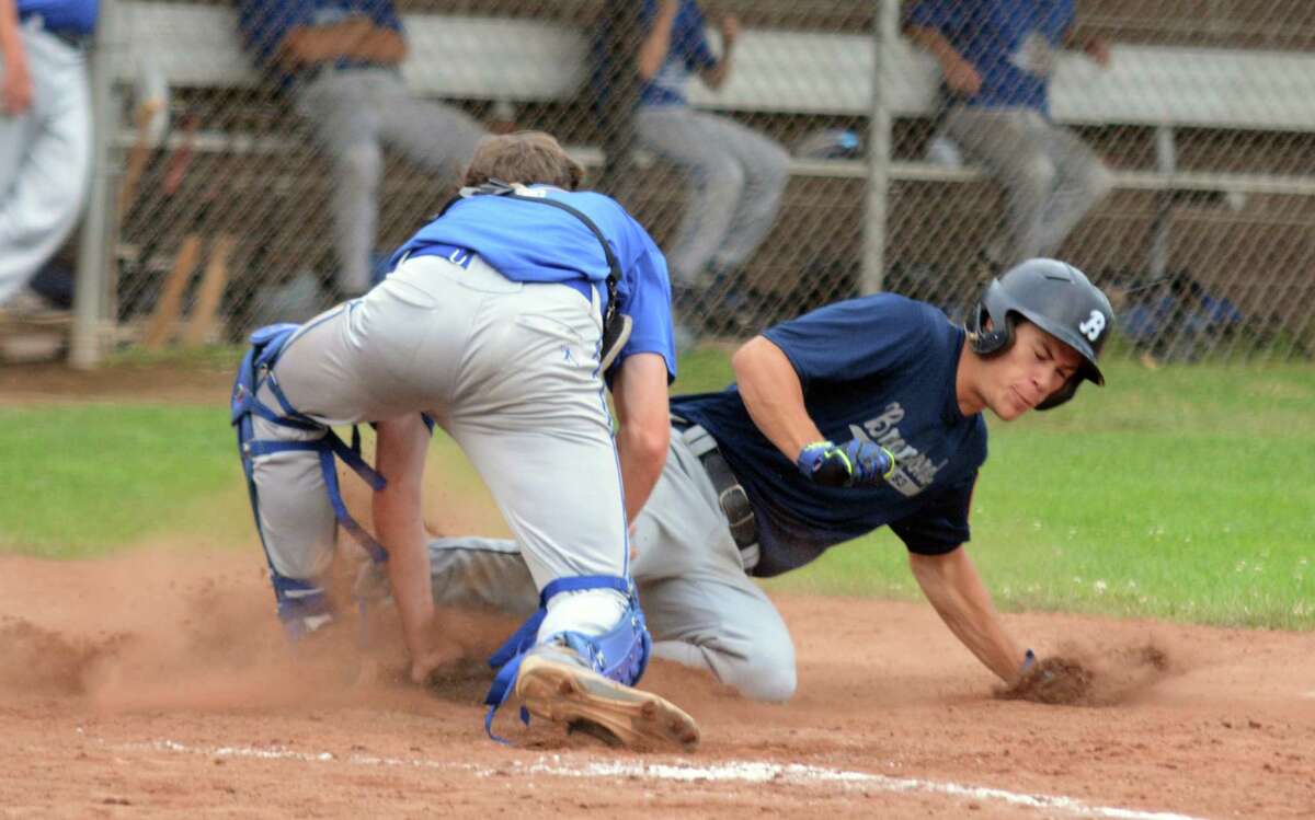Branford’s Chris Stankiewicz is tagged out at home by West Haven’s Tim McCarthy.