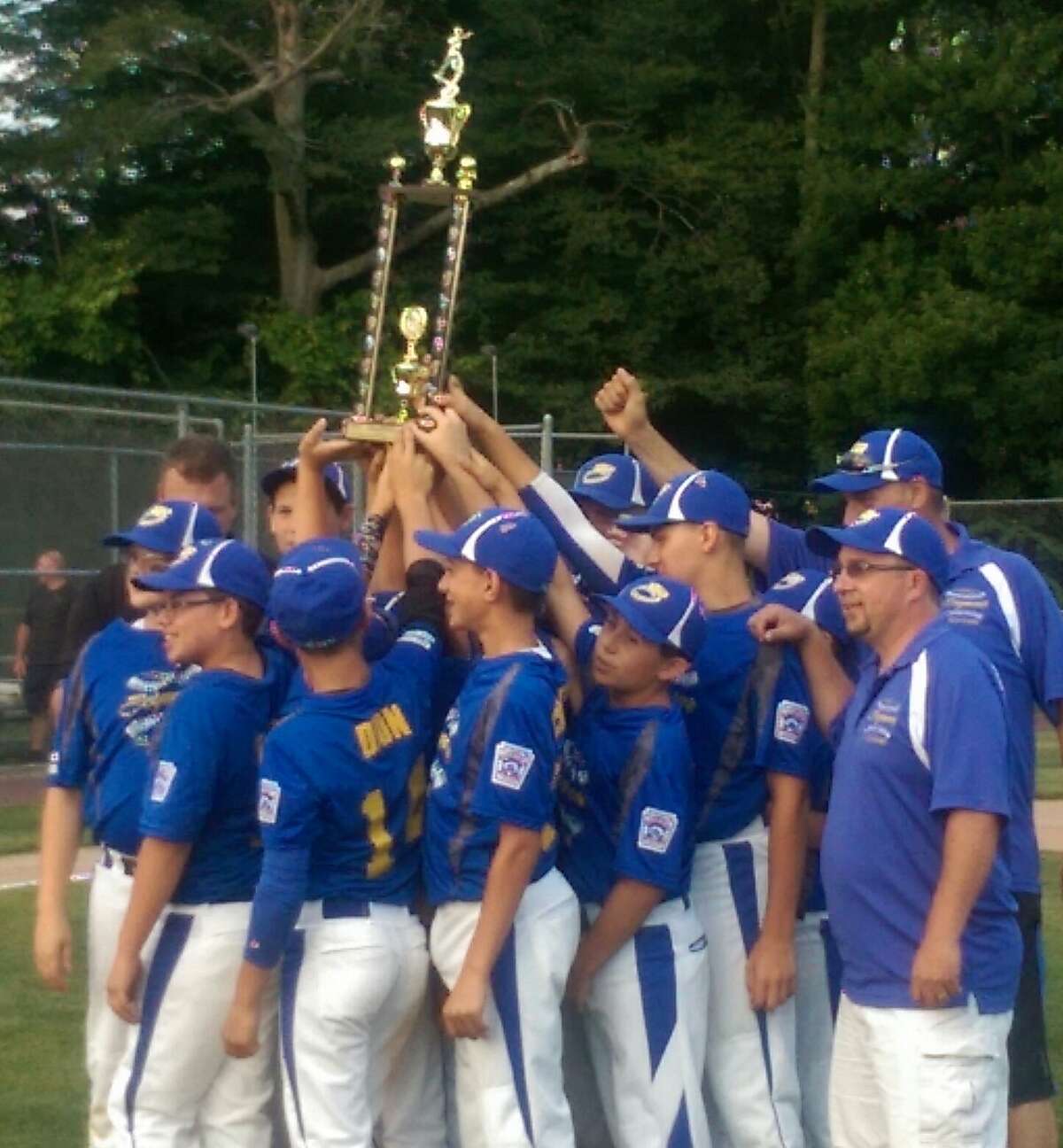 Seymour celebrates its fourth straight District title after its victory over Beacon Falls.