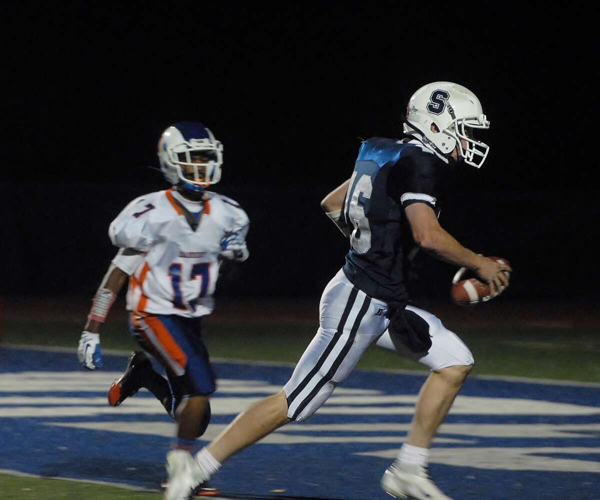 Staples quarterback Jack Massie races into the end zone in the Wreckers’ victory over Danbury Friday (Photo: Mary Albl)