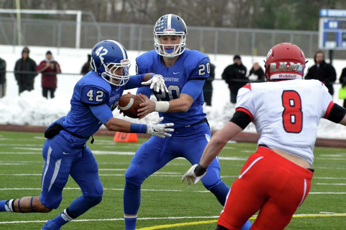 When he’s not throwing for touchdowns, Southington’s all-state quarterback Jasen Rose will be happy to hand off to running back Alessio Diana, who also should be a force in Southington’s backfield this season. (File photo Peter Paguaga)