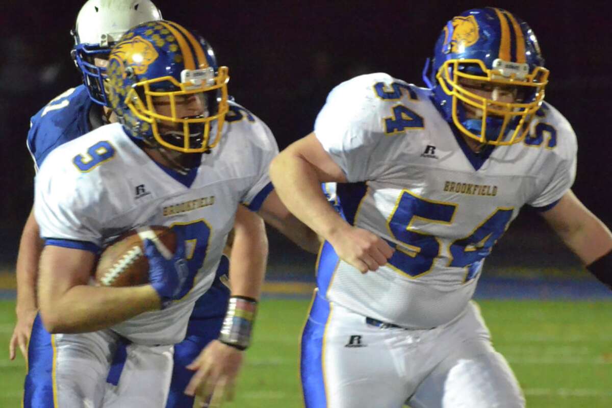 Two-time all-state RB/LB Bobby Drysdale (left) and returning senior lineman Sam Flynn during last year’s regular-season game vs. Newtown. With a massive and talented senior class Brookfield has come of age in 2015. (File Photo Peter Paguaga)