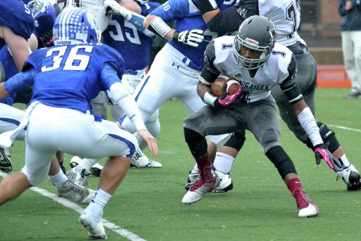 Naugatuck’s Antoine Sistrunk, right, vs. Darien in last year’s state playoffs, is expected to be one of the top running backs in the NVL.