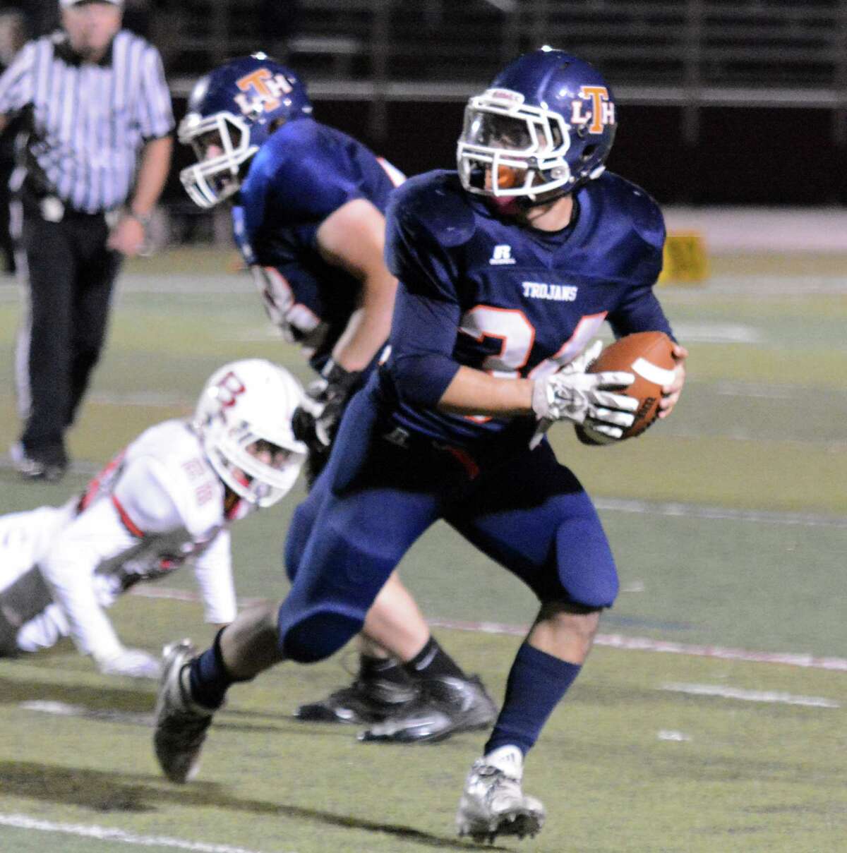 Lyman Hall’s Anthony Esposito prepares to throw an option pass in a 28-6 loss to Branford (Photo Dave Phillips)