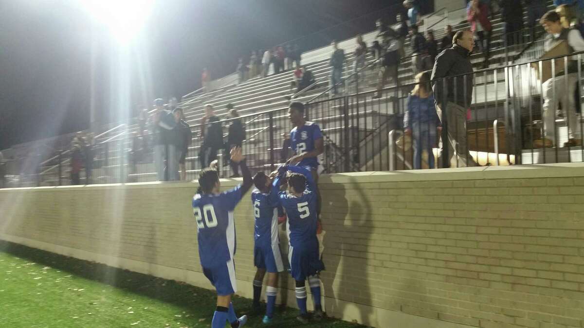 West Haven’s Kevin Ruiz (12) and his teammates celebrate Monday’s victory against Fairfield Prep.