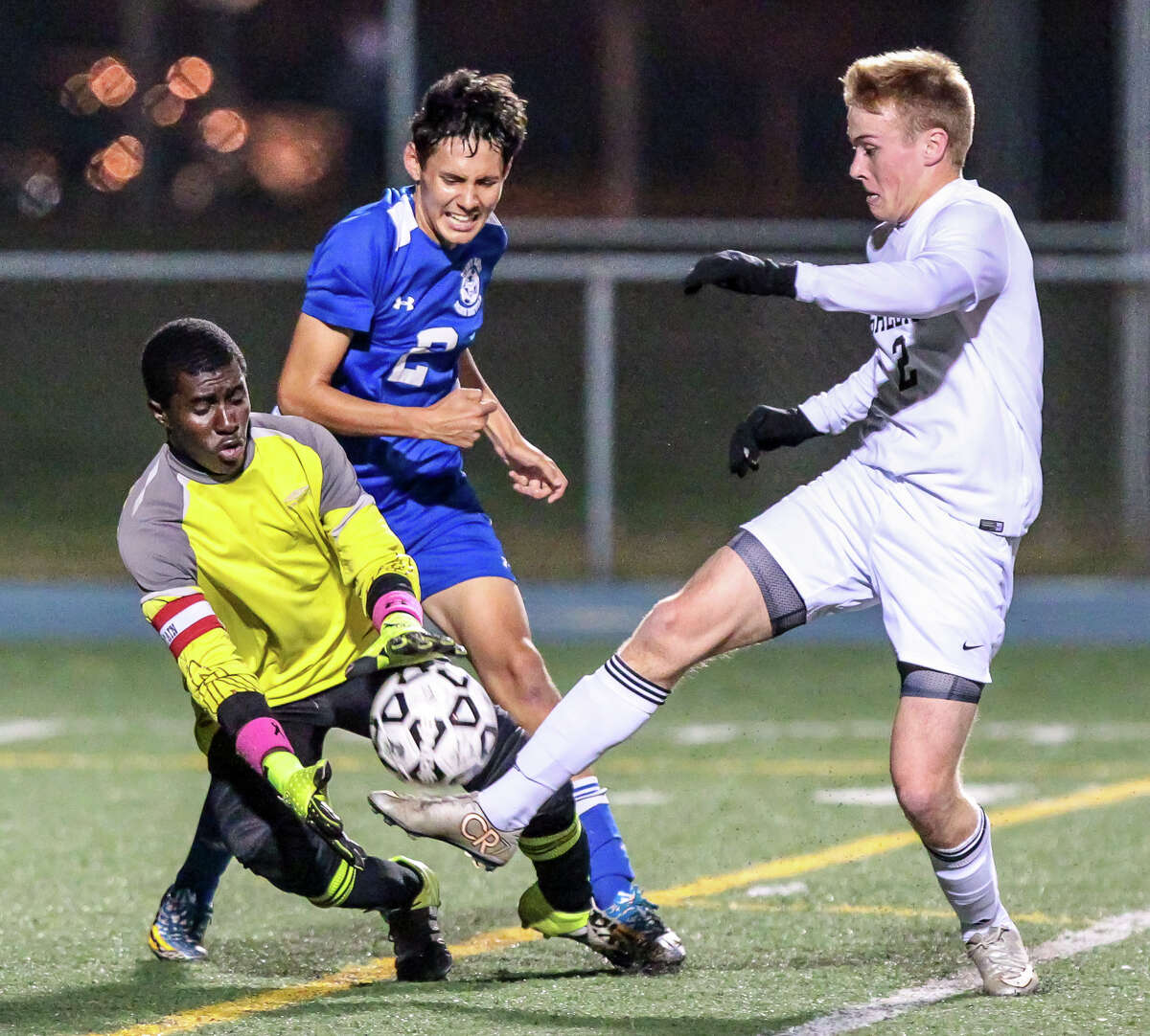 Shelton Gael Ken Schif looks to score past goal tender Garfield Robinson during the Gaels win over the West Haven Blue Devils for the SCC boys soccer Crown Wednesday evening.