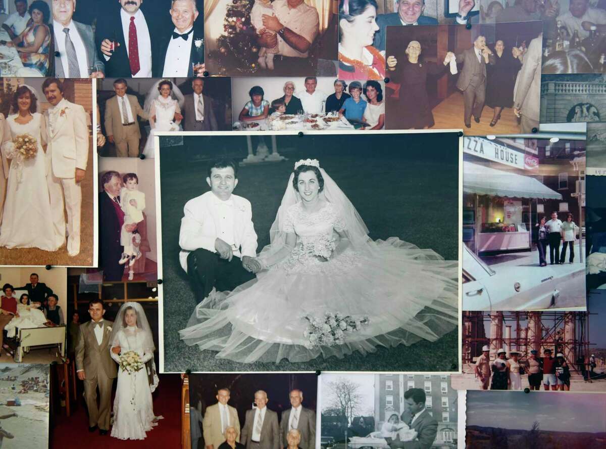 A photograph of Steve Katsetos and his wife, Freda, on their wedding day is displayed at his wake at Church of the Archangels in Stamford, Conn. Wednesday, April 20, 2022. Katsetos, owner of the long-running pizza restaurant Atlantic Street House, died on Apr. 19 at the age of 95 surrounded by all four of his daughters.