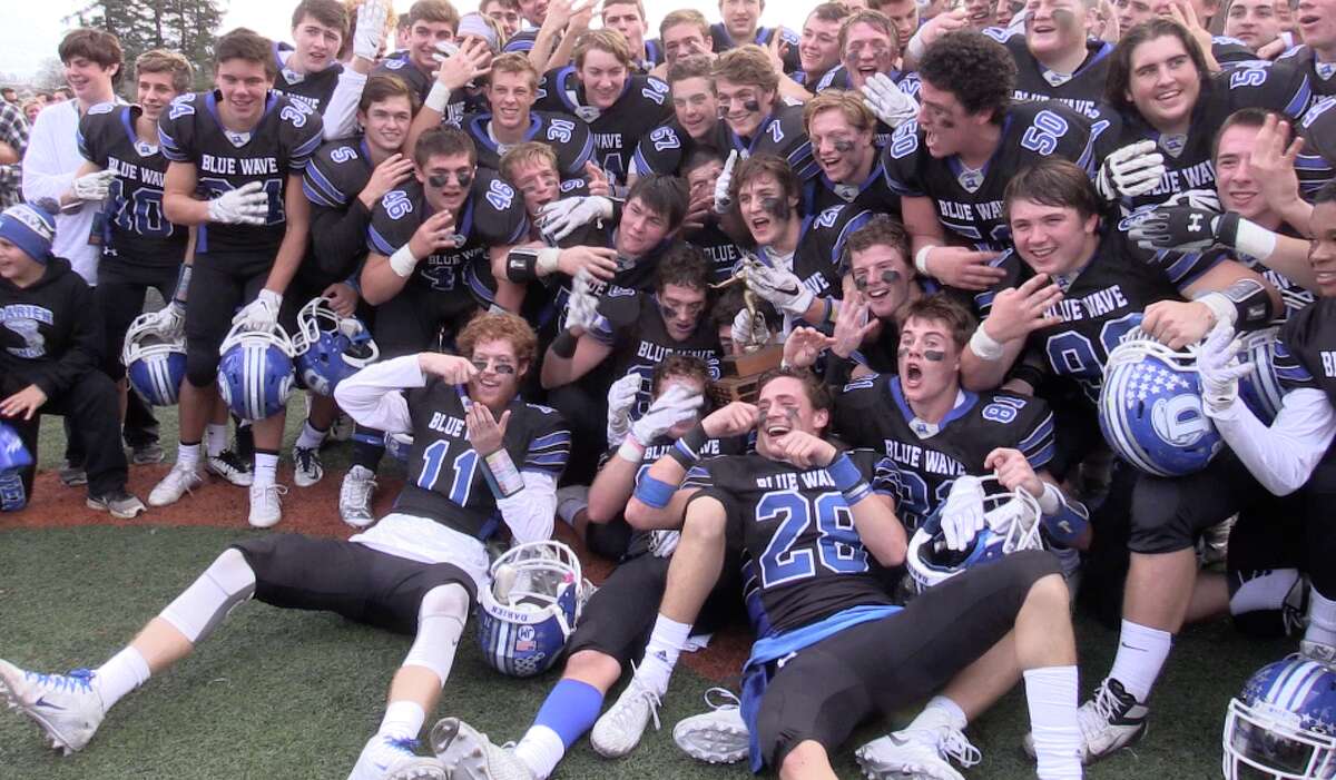 Darien celebrates its second-consecutive FCIAC Championship after a 28-21 victory over New Canaan at Boyle Stadium on Thanksgiving Morning (photo Sean Patrick Bowley)
