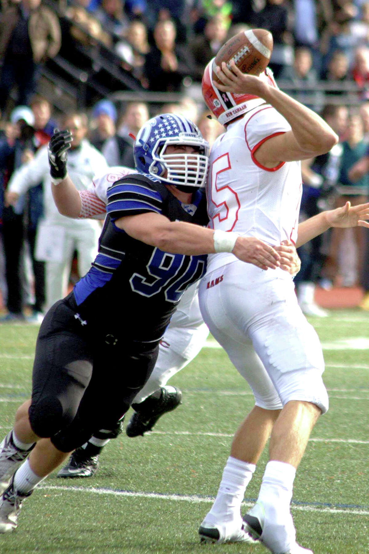 Darien’s Mark Evanchick sacks New Canaan’s Mike Collins during the FCIAC Championship at Boyle Stadium on Thanksgiving (Photo Charles Barthold, Darien Football)