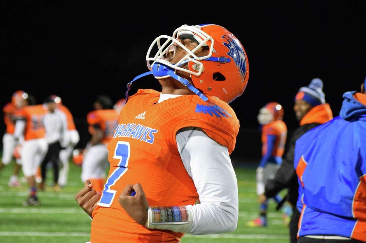 Bloomfield quarterback Rayshawn Phillips lets out his emotion after beating Seymour in the Class S semi-finals. Photo by Derek Turner.