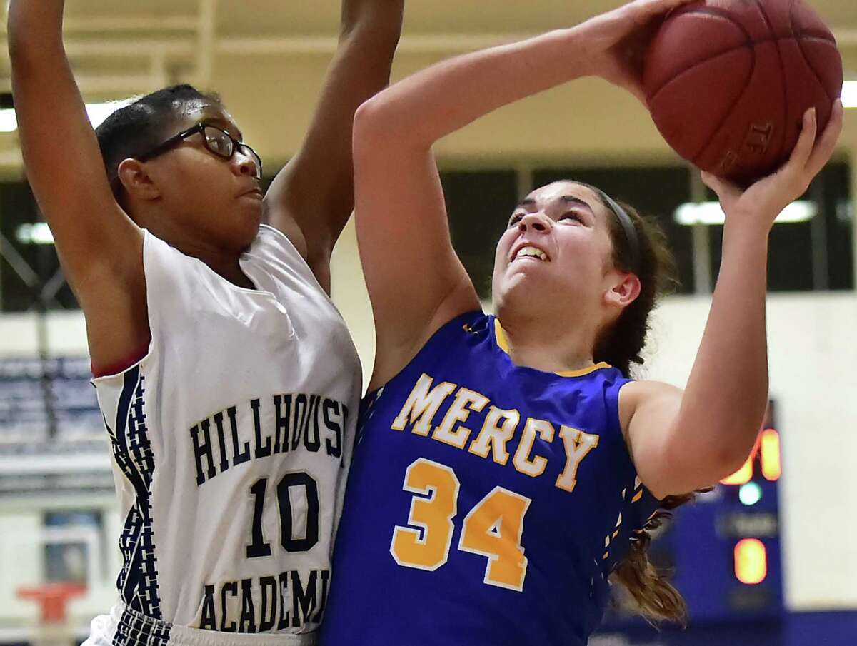 Mercy’s Samantha Gallo goes up for two as Hillhouse guard Tyee Allen as the Tigers defeat the Academics, 64-45, Wednesday, December 16, 2015 at the gymnasium at James Hillhouse High School. (Catherine Avalone/New Haven Register)