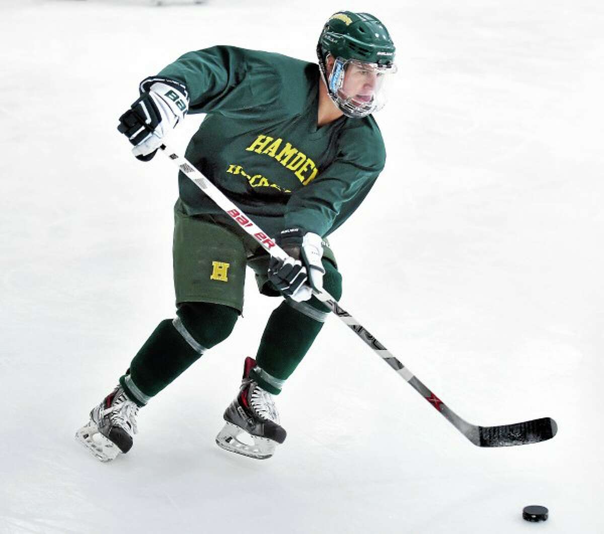 (Arnold Gold-New Haven Register) Christian Ugolik, photographed during practice at Astorino Rink in Hamden, is expected to lead a strong Green Dragons team this season.