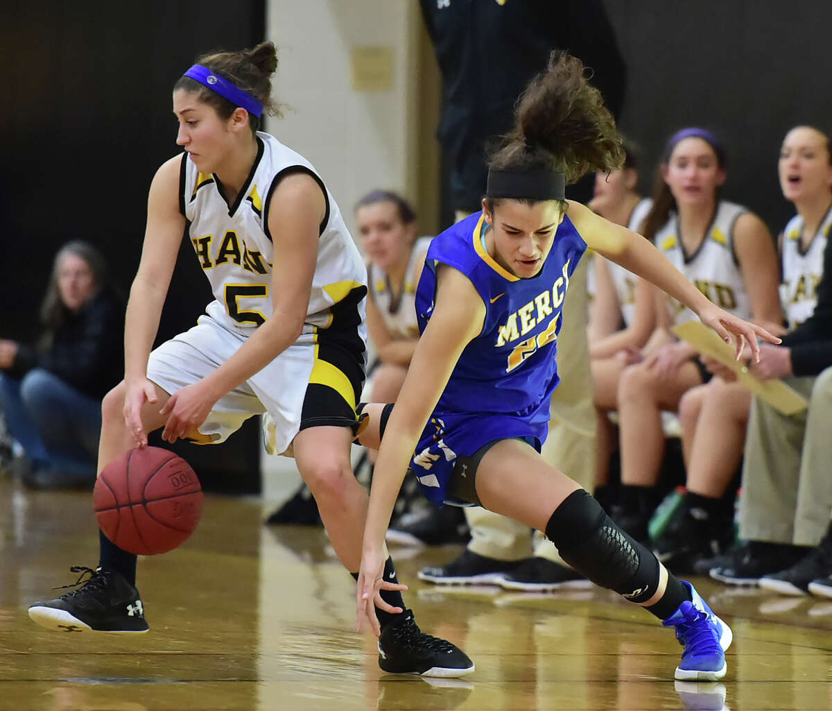(Catherine Avalone – New Haven Register) Mercy junior Keri Kernisan attempts to steal back the ball from Hand’s Gillian Draemer defends in a 77-56 win for the Mercy Tigers, Wednesday, January 27, 2016, at Daniel Hand High School in Madison.