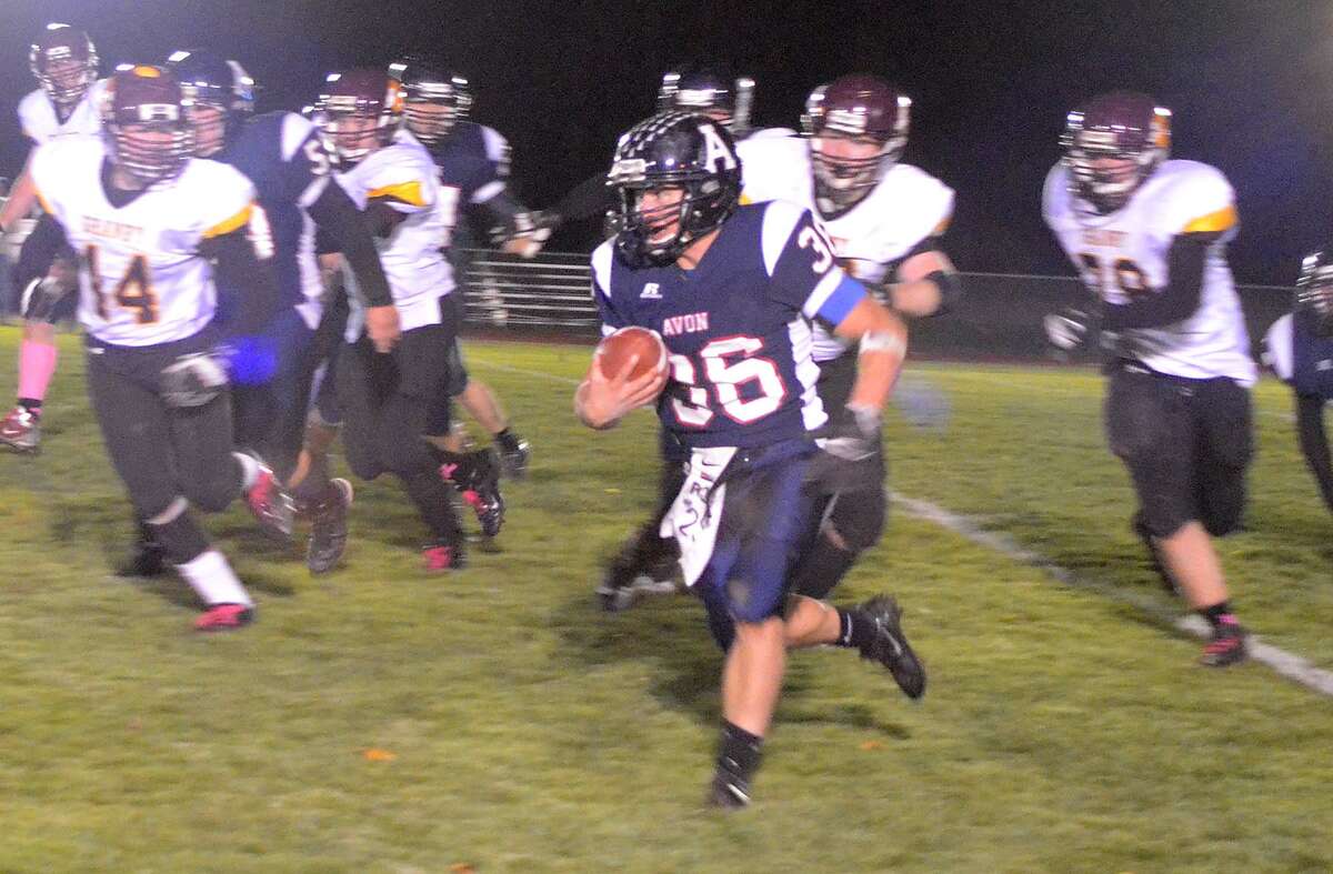 Avon’s Jimmy Murphy (36) gets into open space in Saturday’s win over Granby.