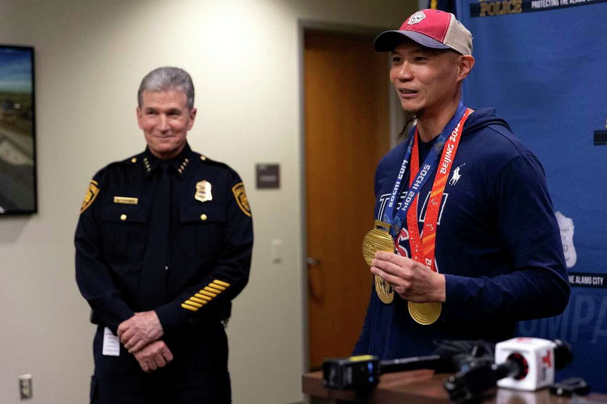 San Antonio Police Chief William McManus and Paralympian Jen Lee speak at a news conference on Wednesday after McManus was able to return the gold medals that Lee won as a member of the U.S. sled hockey team. 