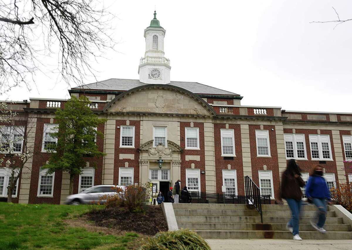 Students are dismissed at Stamford High School in Stamford, Conn. Monday, April 12, 2021.