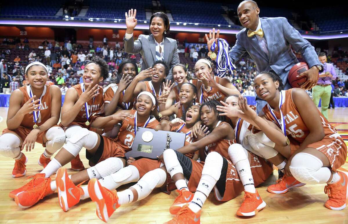 (Arnold Gold-New Haven Register) Capital Prep girls celebrate their win over New London in the Class L Championship at the Mohegan Sun Arena on 3/20/2016.