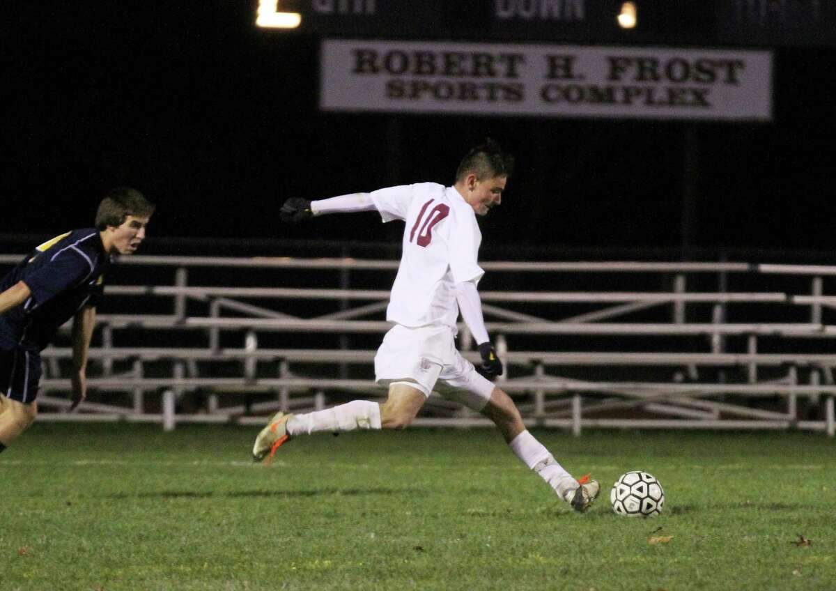 Torrington’s Amar Suljic shots and scores the lone goal in the Red Raiders 1-0 win against Woodstock Academy in the first round of the Class L State Tournament.