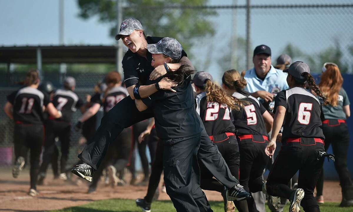 (Catherine Avalone – New Haven Register) Cheshire head coach Kristine Drust celebrates with her assistant coach following junior Hannah Salvietti’s walk off RBI for the SCC Softball Championship win,defeating the Lauralton Hall Crusaders, 4-3, Saturday, May 28, 2016, at Biondi Field at West Haven High School.